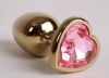 Золотистая анальная пробка с розовым стразиком-сердечком - 7,5 см. фото 1 — pink-kiss