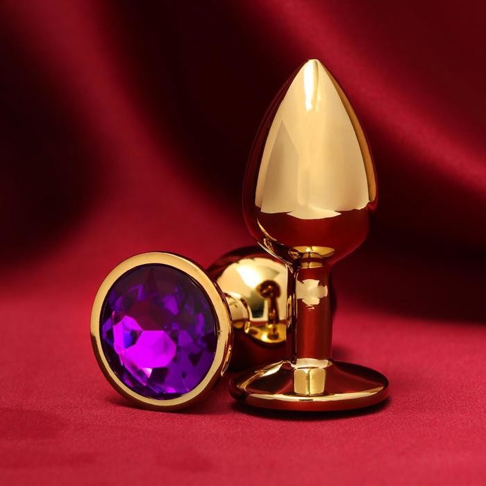 Золотистая анальная пробка с фиолетовым кристаллом фото 1 — pink-kiss