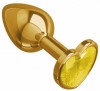 Золотистая анальная втулка с желтым кристаллом-сердечком - 7 см. фото 1 — pink-kiss