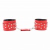 Красные кожаные наручники с клепками фото 3 — pink-kiss