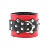 Красные наручники с чёрными проклёпанными ремешками с пряжкой  фото 4 — pink-kiss